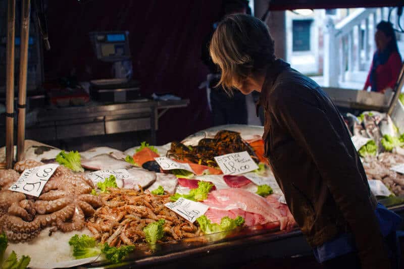 Inspecting fresh fish in the Rialto Market